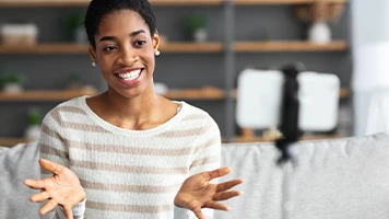 woman recording video on her phone